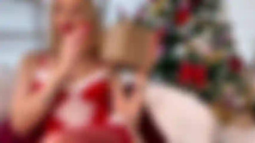 Christmas warmth, soft lights, an unwrapped kind of gift. Im topless, playful but unhurried, enjoying the stillness of the season. Cozy, sensual, and personal, like a private moment by the tree.