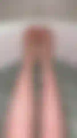 The toes and legs of a Goddess delicately submerged into a bath while I gently caress them