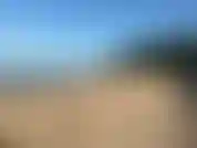 Caminando por la playa y luego bañándome.