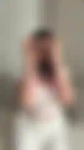 massages DD's tits in a transparent wet T-shirt