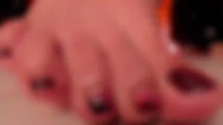 zoom of fat toes and shiny nails