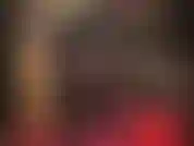 Body de nailon negro opaco y cuero: como una villana sexy, la amante vivian está vestida con un traje de gato negro y guantes de cuero, corsé y botas exigiendo adoración.