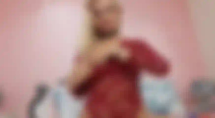 Chupando_mi_dildo_in_a_red_outfit_teasing_you_big_tits.