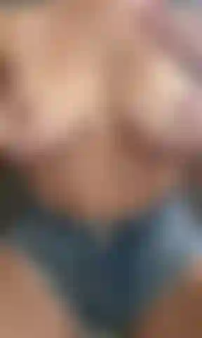 Oily tit rub in denim shorts. Watch me get my big sexy tits all oiled up, rubbing them and playing with my nipples