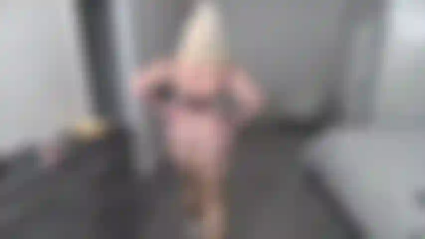 WALKING BACK & FOURTH IN G-STRING, WHITE PUMPS, BRA, TAN