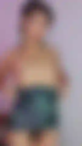 Sexy girl puts on a dress in front of the camera