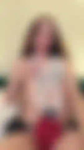 "On the bed, in tight lingerie, she plays with her body while her soft moans invite you to want more... impossible to resist."