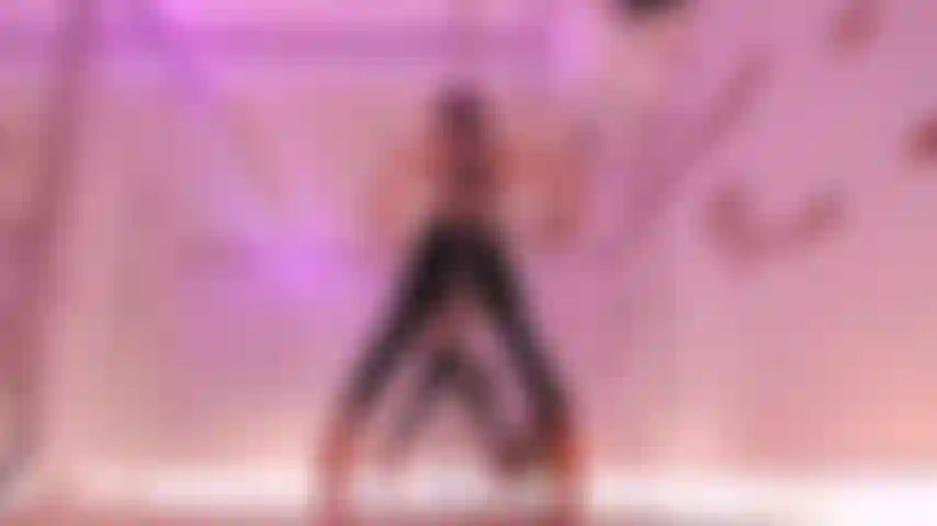 Sexy exotic pole dance - strong hands, flexibility and long legs in high heels